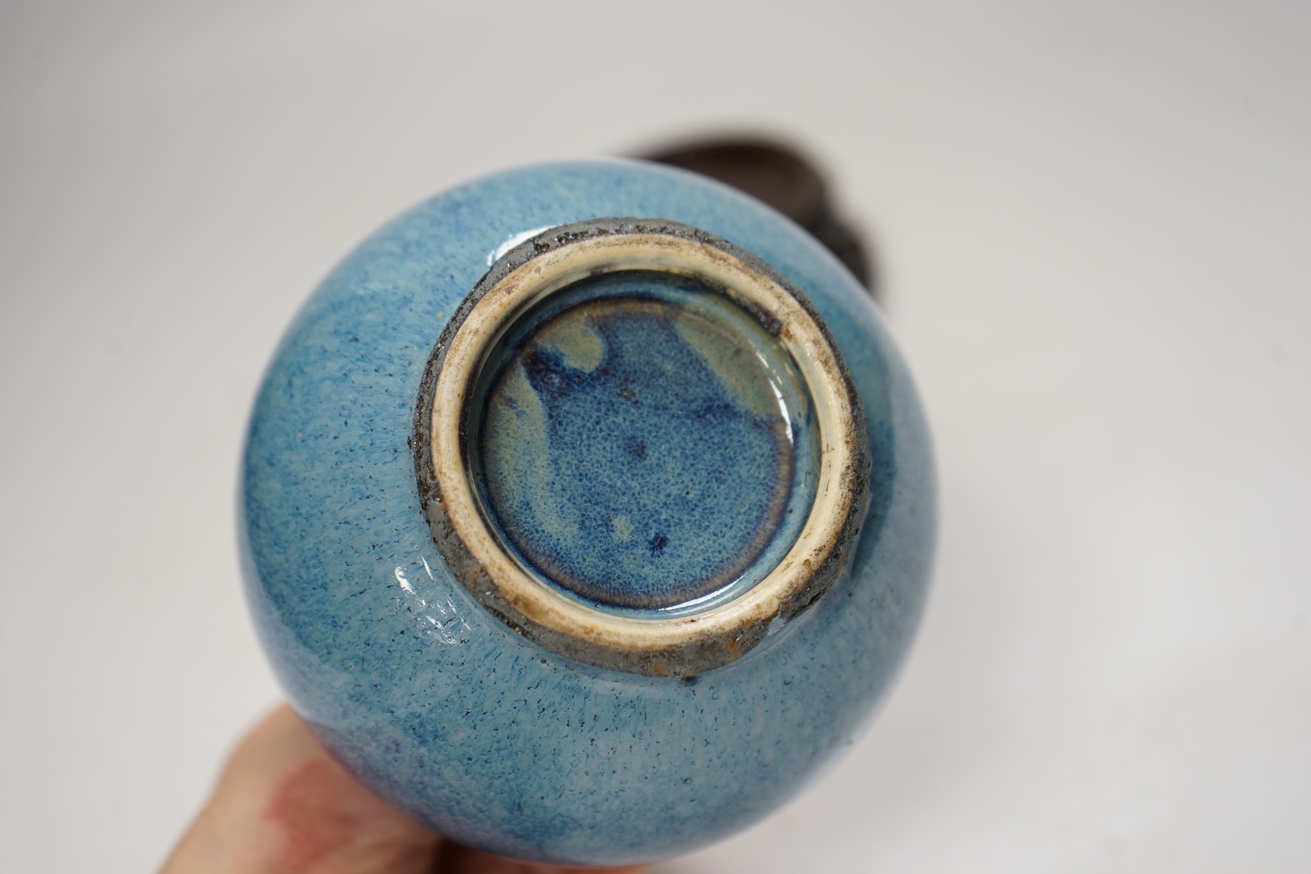 A Chinese blue flambe bottle vase, on stand, 22cm